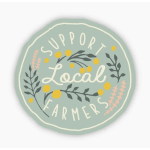 Round sign reading "Support Local Farmers" with floral graphics
