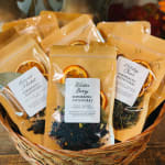 Basket of simmering potpourri packets with dried orange slices