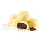 White chocolate truffles with a dark chocolate filling on a white background