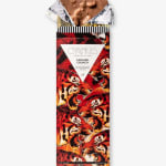 Chocolate bar in red tiger-print wrapper with foil top exposed