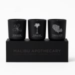 Three black candles in a gift box with coastal labels