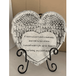 Heart-shaped memorial plaque on a metal stand with angel wings and text