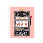 Greeting card with a slot machine and hearts on a pink background