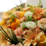 Peach and yellow mixed bouquet with white roses and carnations