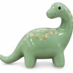 Green ceramic dinosaur figurine with yellow spots on a white background