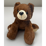 Brown plush teddy bear seated on a white surface