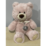 Pink plush teddy bear with a ribbon and heart pendant