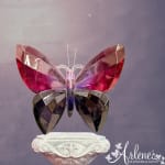 Decorative crystal butterfly ornament on a pedestal