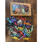 Box of assorted wrapped chocolates tied with twine on a wooden surface