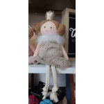 Plush princess doll with glitter crown, furry beige dress, and rope legs sitting on a shelf