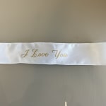White satin ribbon with gold "I Love You" lettering