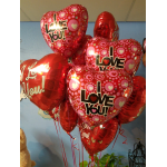 Bouquet of red and pink heart-shaped 'I Love You' balloons on long ribbons