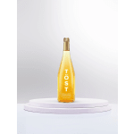 Bottle of sparkling white tea on a white pedestal