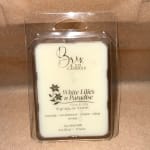 Packaged white wax melt in a clear plastic clamshell