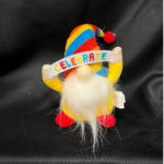 Small plush gnome with a rainbow hat and a "CELEBRATE" banner