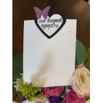 Sympathy card with a heart topper surrounded by pink and white flowers