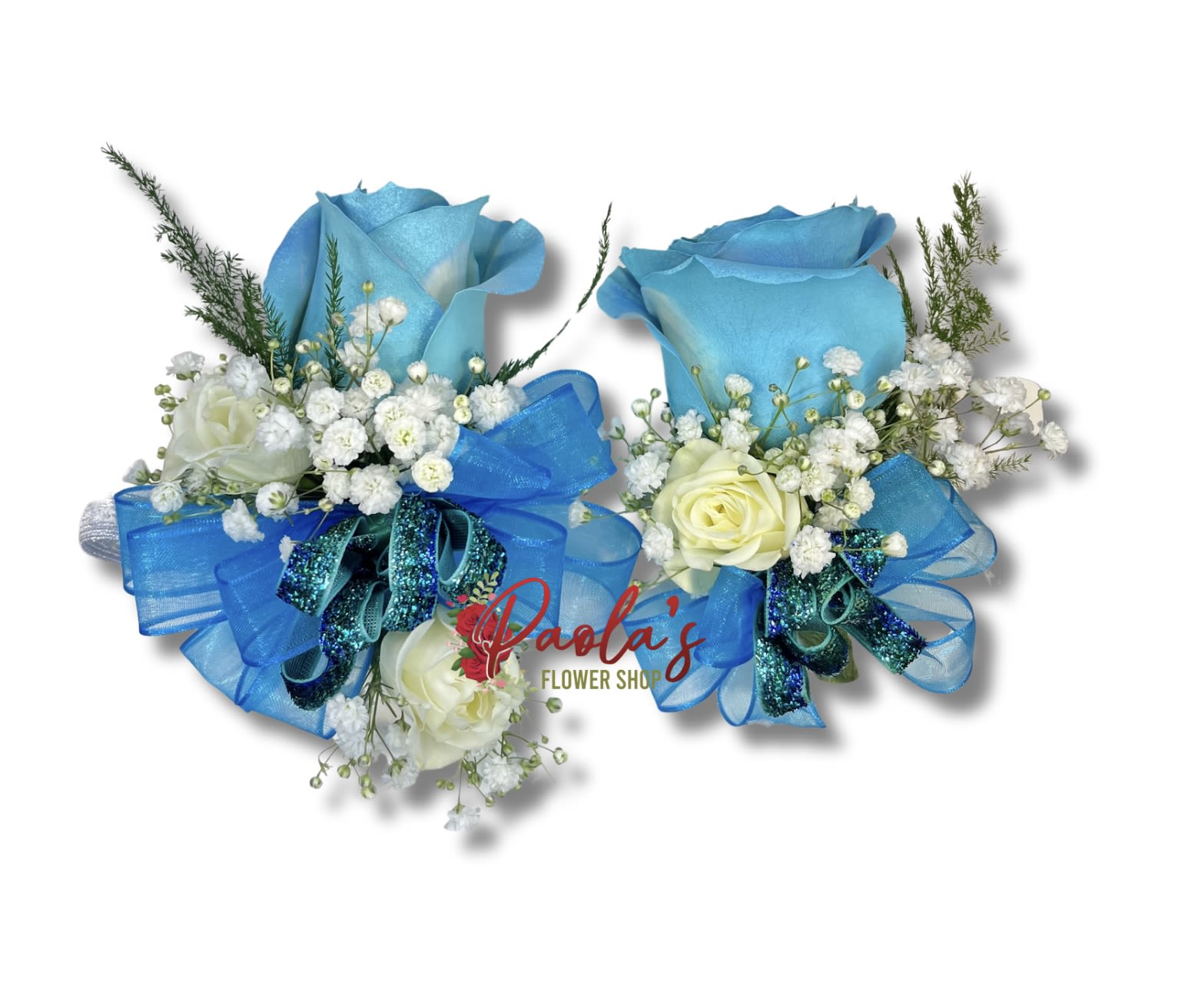 Two blue rose bouquets with white filler flowers and ribbon bows