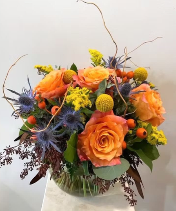 Autumn Sunset - Beautiful sunset colors of blue, orange &amp; yellow. Brighten up your space with these stunning flowers and colors.  *Containers and flowers may vary based on seasonal availability