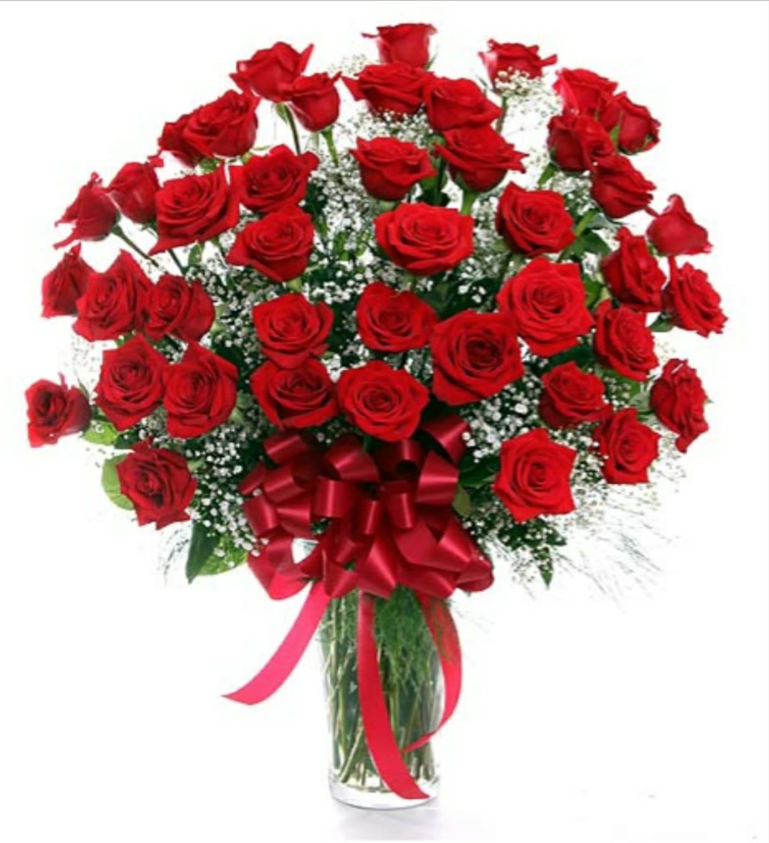 Bouquet of red roses in a glass vase with a red ribbon bow
