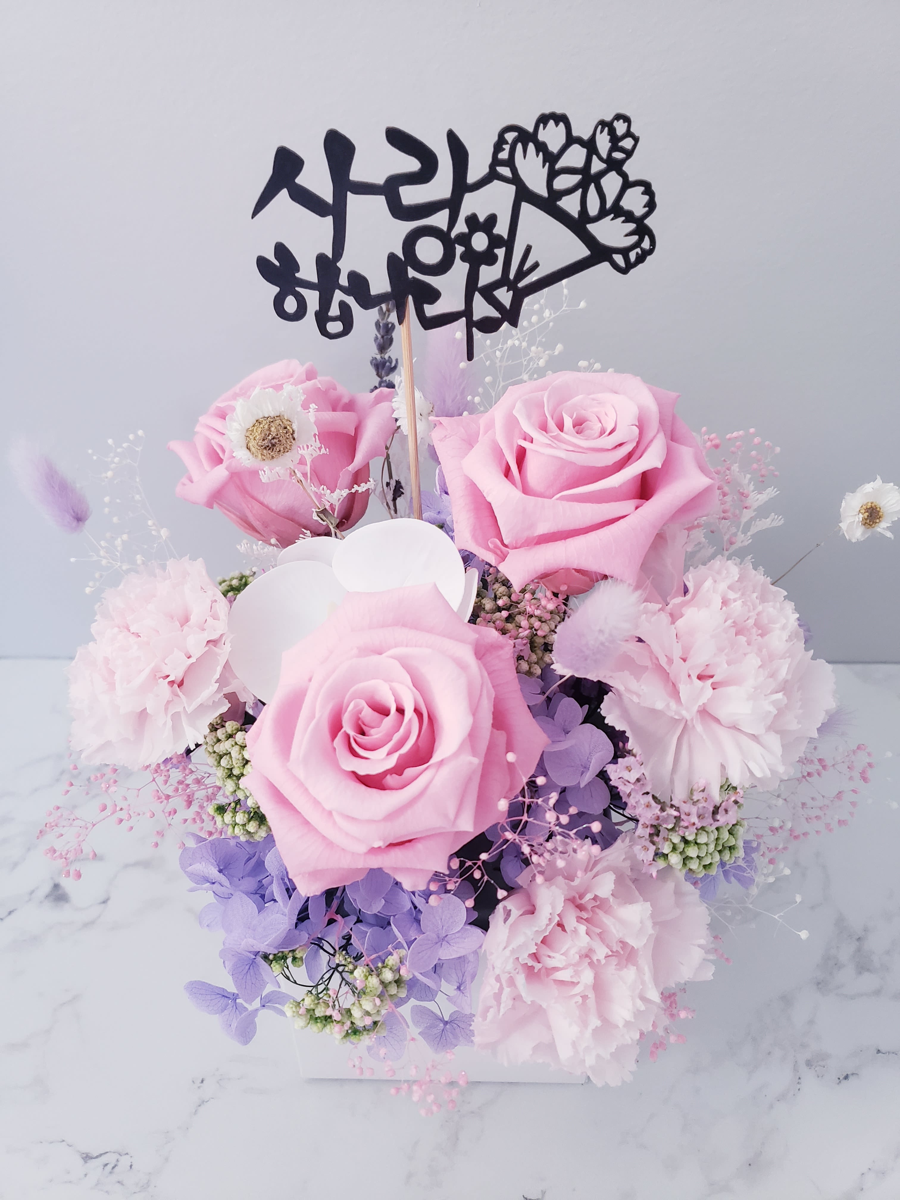 Pink rose and carnation bouquet with a Korean topper