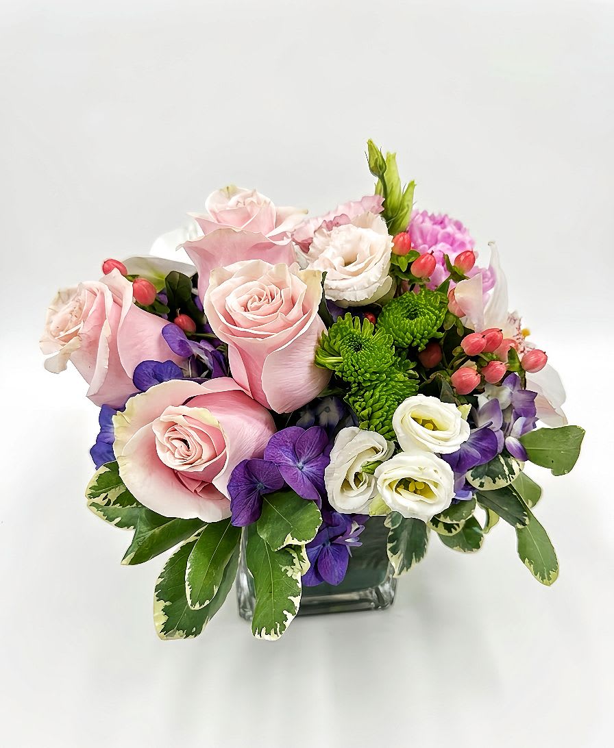 Enchanted Blush - A premium and artistic all-around floral arrangement designed to showcase unique luxury from every single angle.  