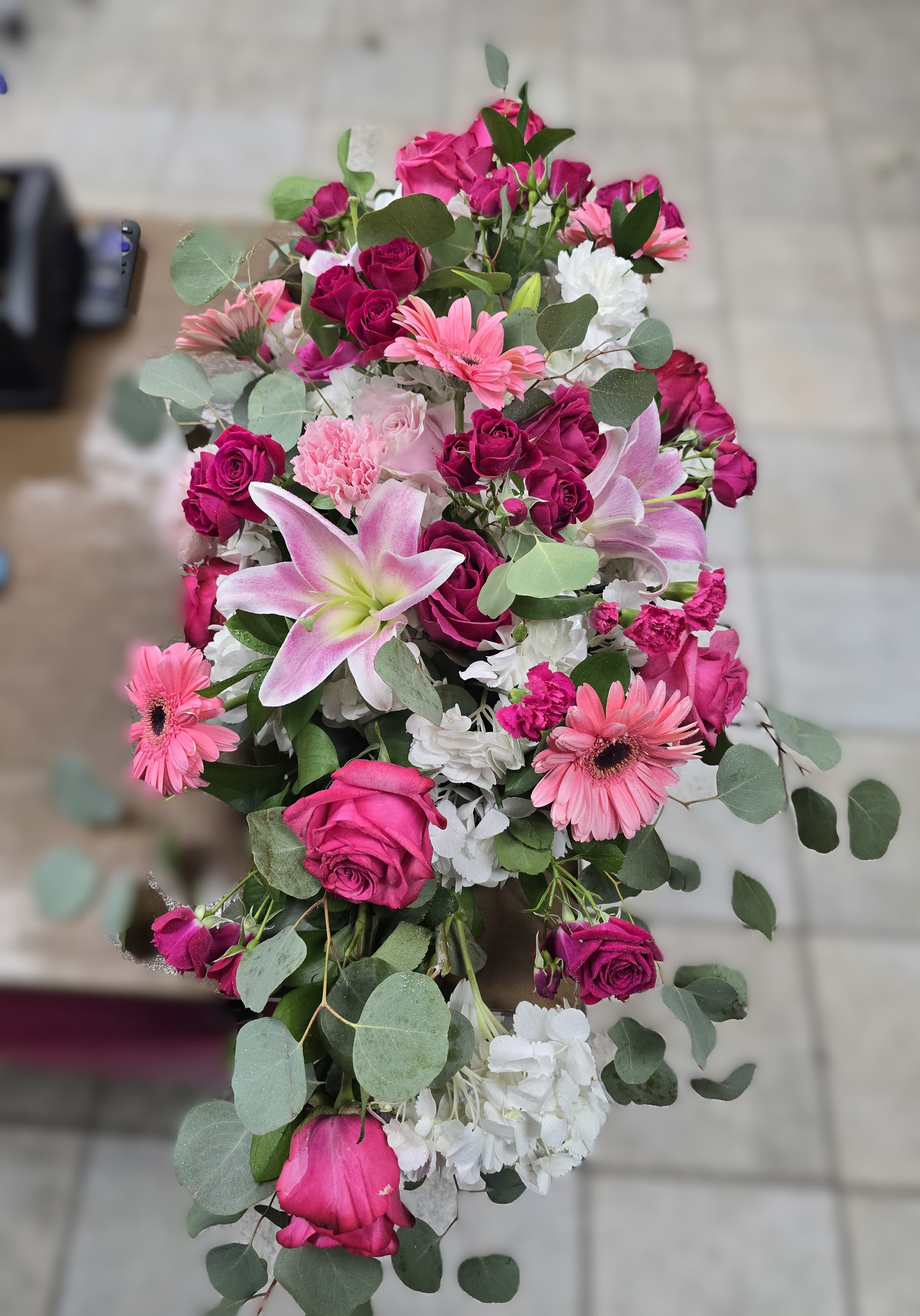 Bouquet of pink and white flowers with eucalyptus greenery