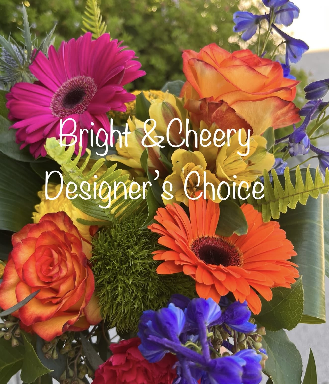 Bright mixed bouquet with gerbera daisies, roses, and blue flowers