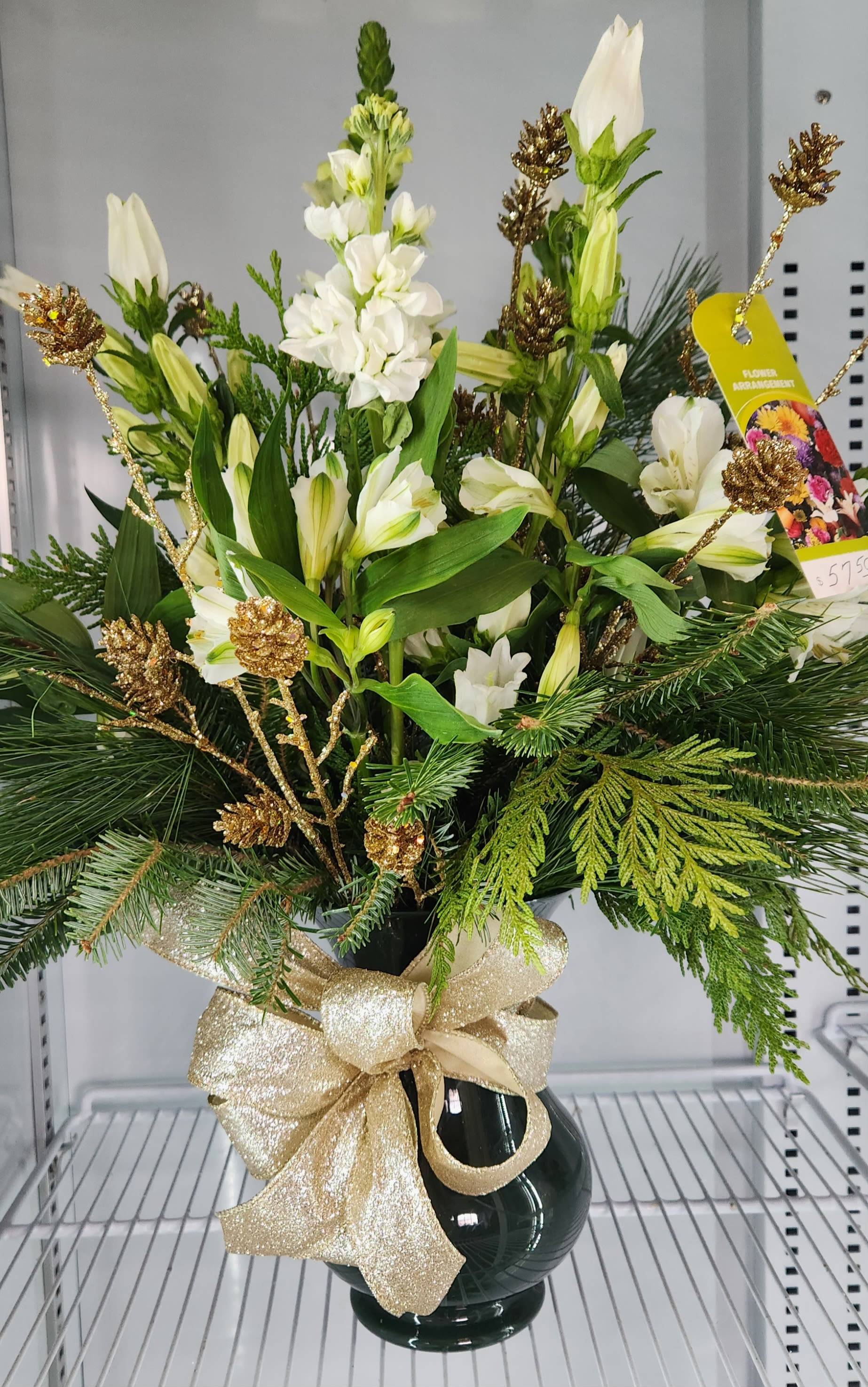 Emerald Green and Gold - Elegant arrangement of mixed white flowers arranged in a green vase of mixed evergreens accented with a spray of gold pine cones. - Ottawa Florist