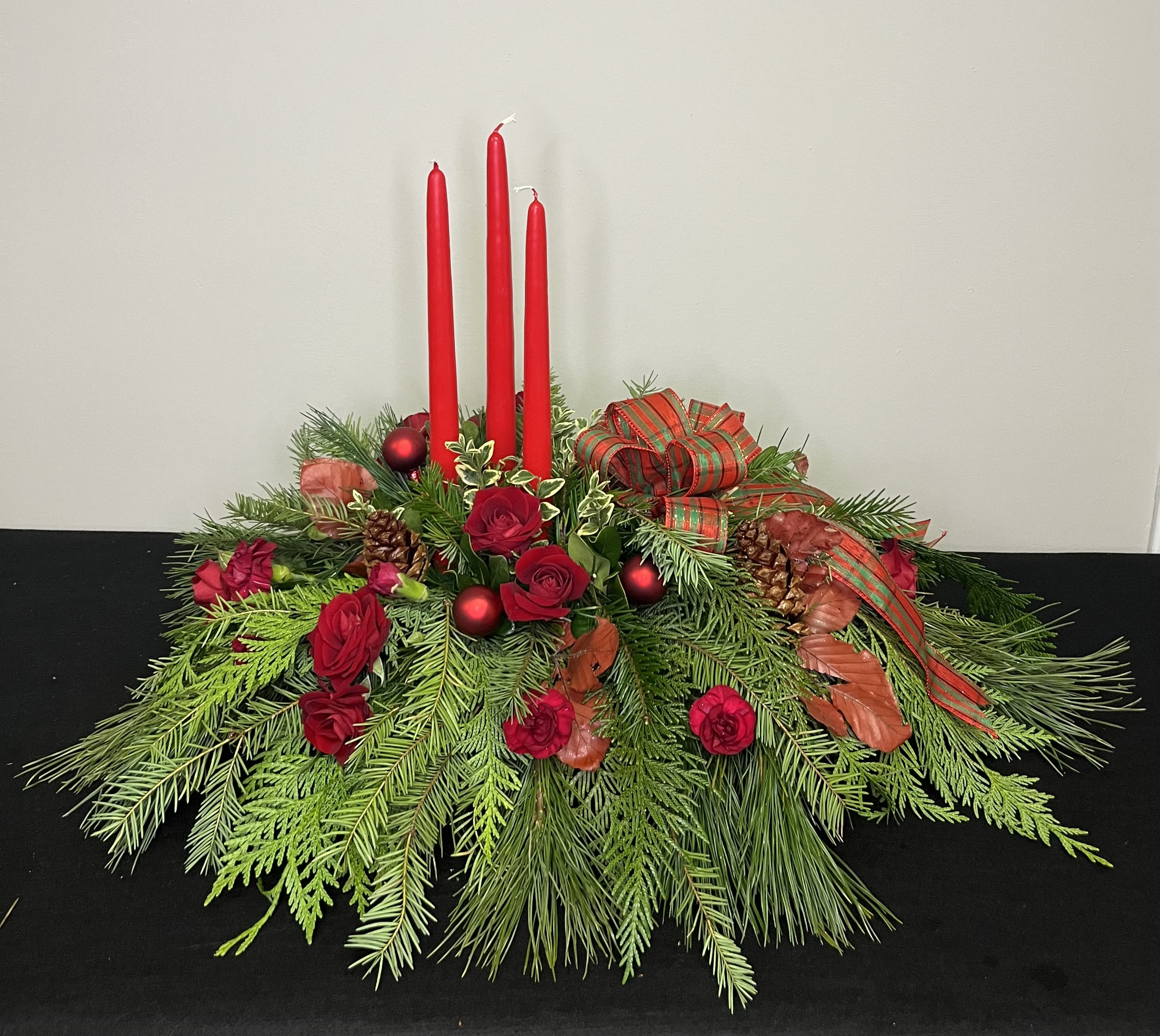 Season's Glow by Chasing Petals - A traditional long and low for your festive table, with a slightly modern twist clustering candles on one side and accenting with red greenery. You can't go wrong with this stunner!  Alternate colours available, please call us to inquire about any alternatives!