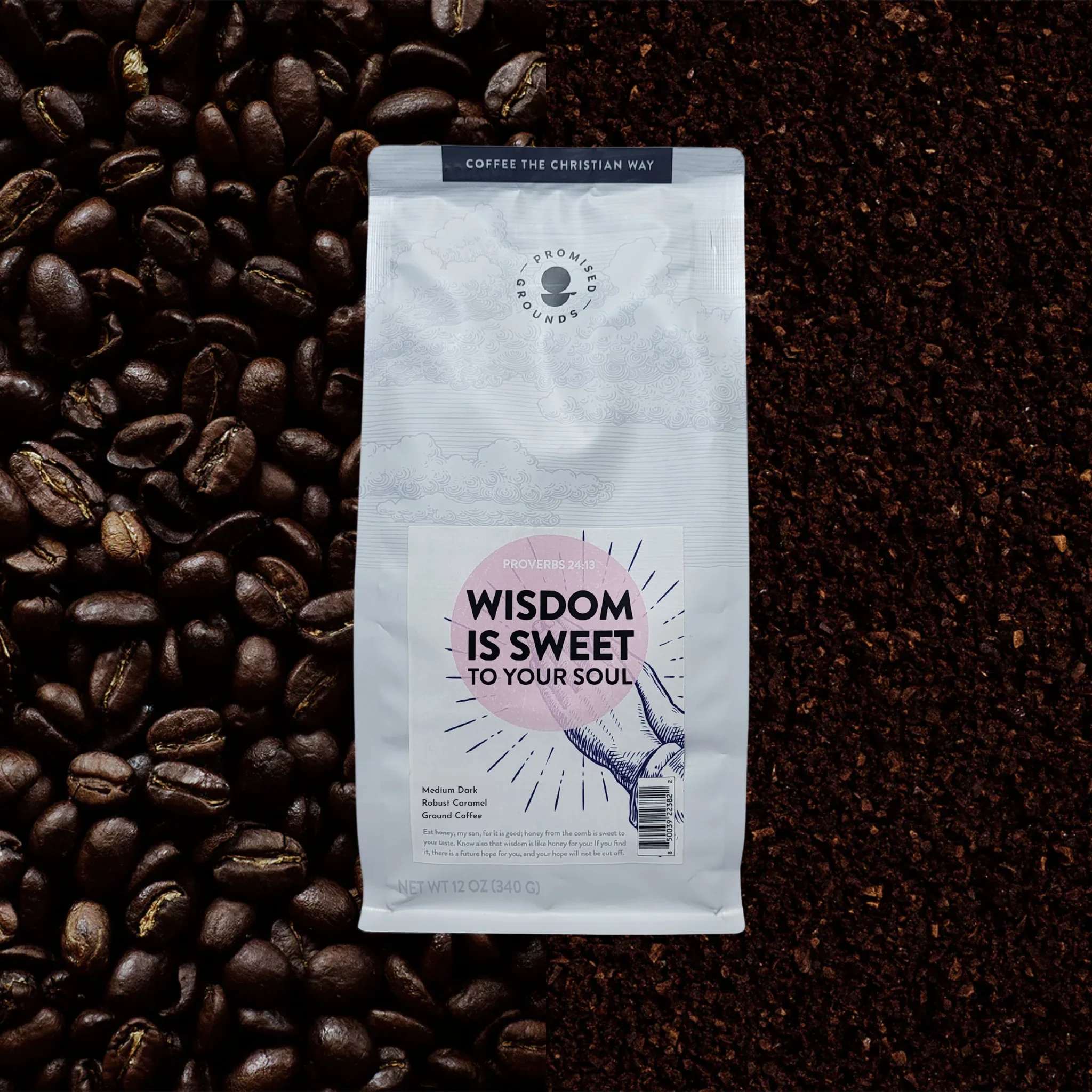 Bag of ground coffee surrounded by coffee beans