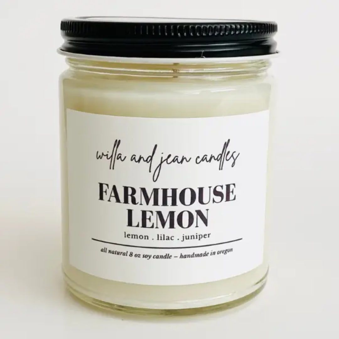 Jar candle with a black lid and Farmhouse Lemon label
