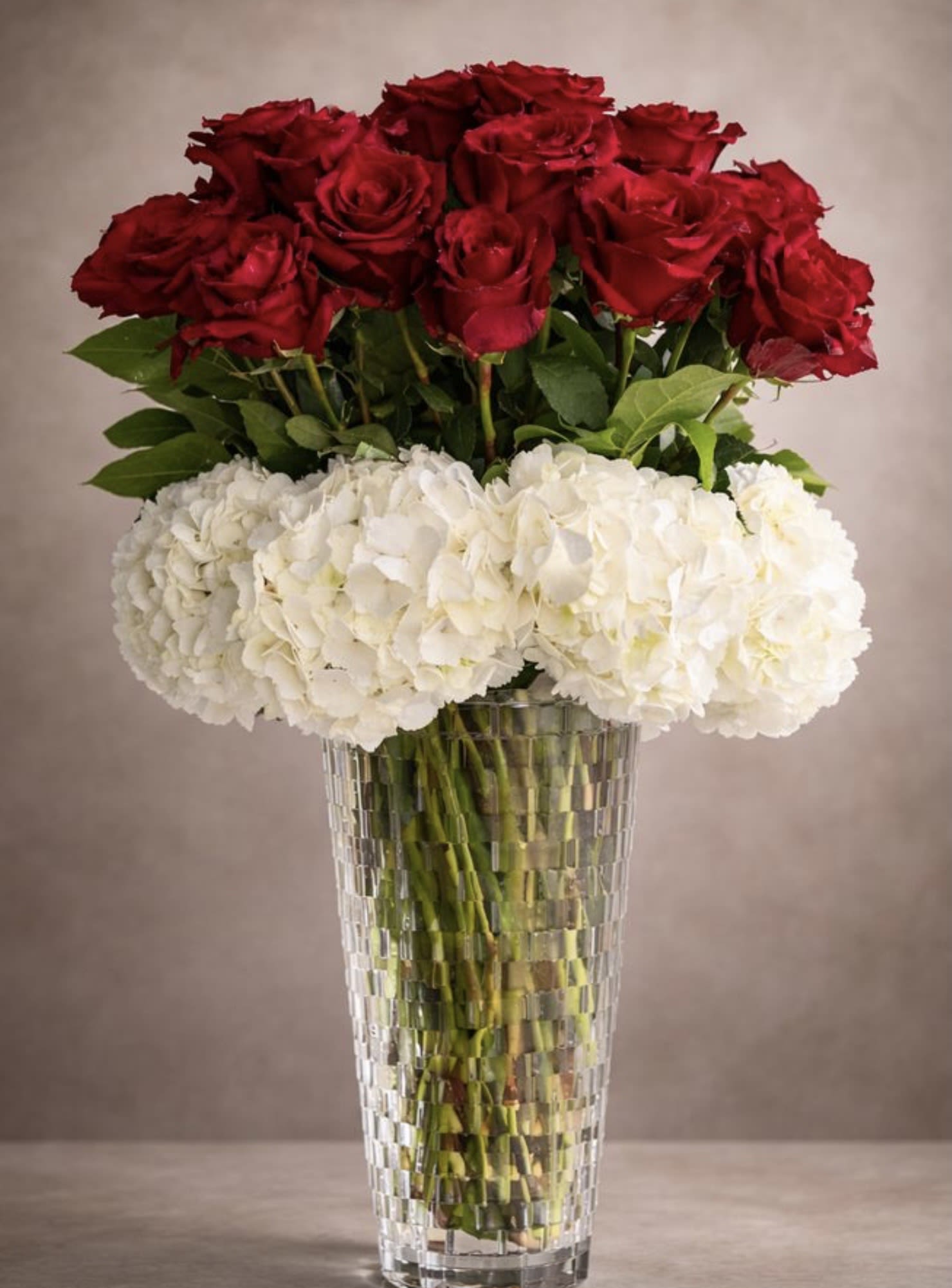 Hydrangeas and roses and any colors  - Elegance in every bloom ️  A stunning arrangement of rich red roses paired with soft white hydrangeas — the perfect balance of passion and purity. Designed in a luxurious crystal vase, this bouquet brings timeless beauty to every special moment.  Perfect for:  Anniversaries  Birthdays  Romantic surprises  Luxury home décor  “Just because” moments  Fresh, graceful, and unforgettable — because love deserves something extraordinary.  Order yours today and make someone’s day truly special! 
