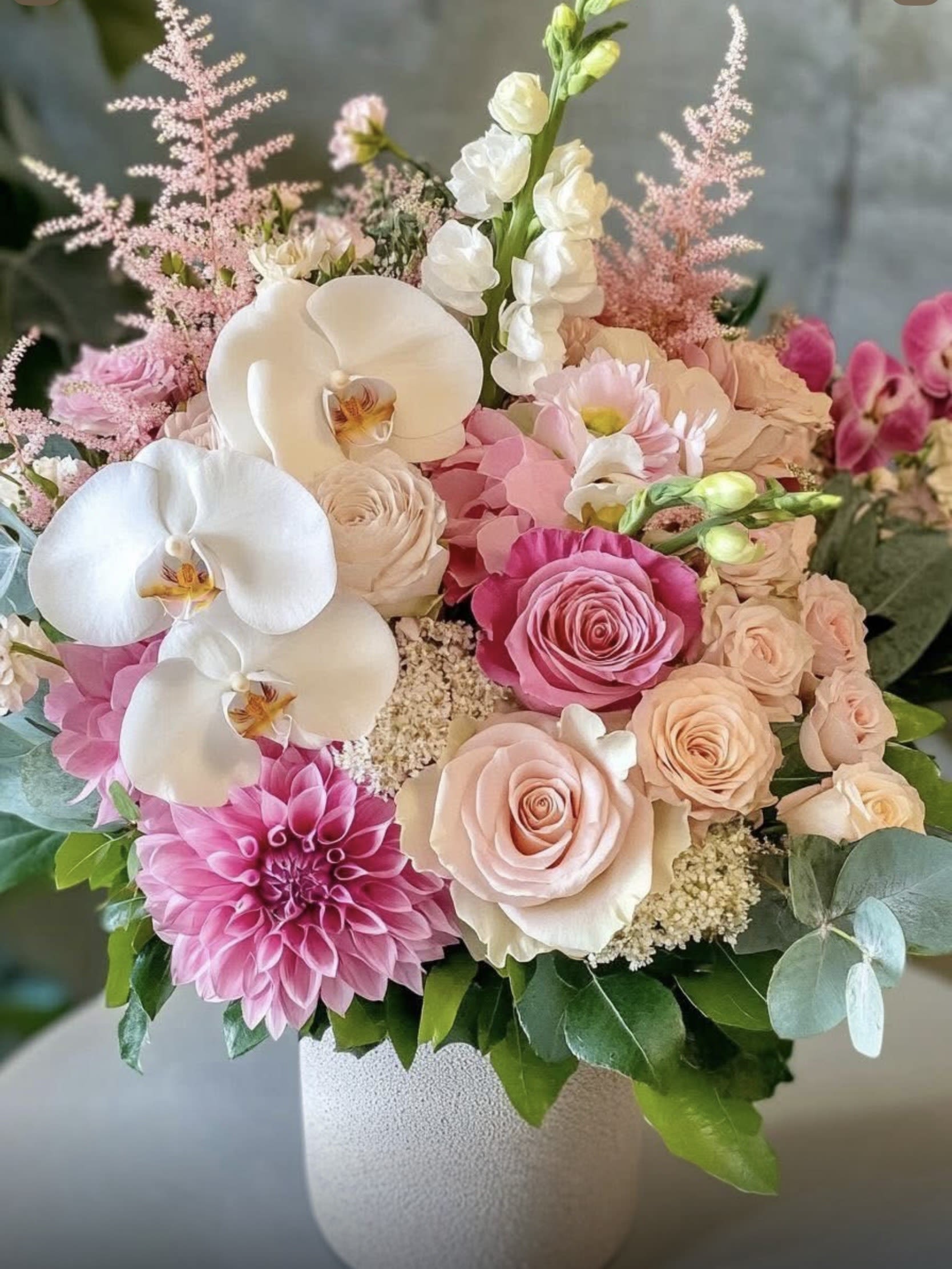 Everything Flowers  - Soft, elegant, and absolutely unforgettable   A dreamy floral arrangement featuring luxurious roses, delicate orchids, blooming dahlias, and romantic pastel blossoms — beautifully designed to bring grace and charm to any moment.  Perfect for:  Birthdays  Baby showers  Anniversaries  Bridal gifts  Luxury home décor  Sweet surprises “just because”  This bouquet is more than flowers — it’s a feeling of love, beauty, and pure elegance.  Freshly arranged with care, made to leave a lasting impression.  Order now and let beauty speak for itself 