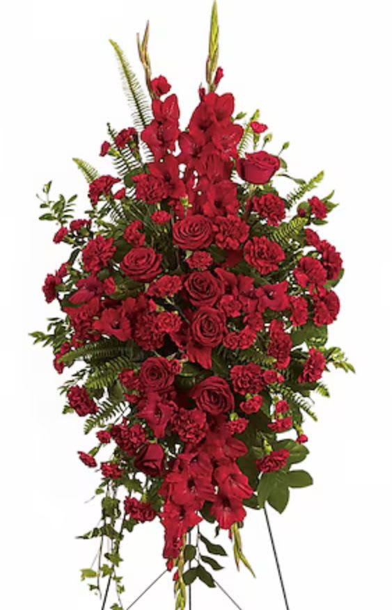 Tall red floral standing spray with roses and carnations