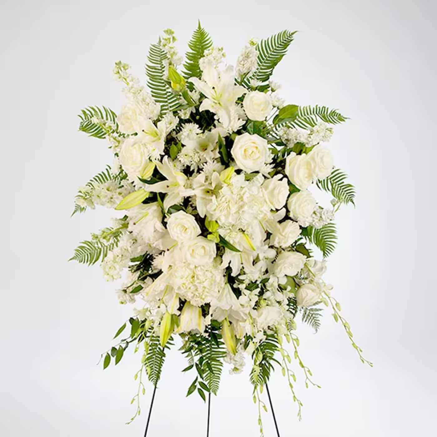 True Sympathy by BloomNation - An all white tribute, this funeral spray is pure and tranquil. Featuring a variety of white flowers and green palms this elegant funeral spray brings a feeling of peace to it's surroundings