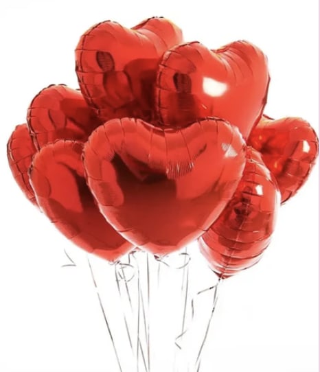 Cluster of red heart-shaped balloons on thin sticks