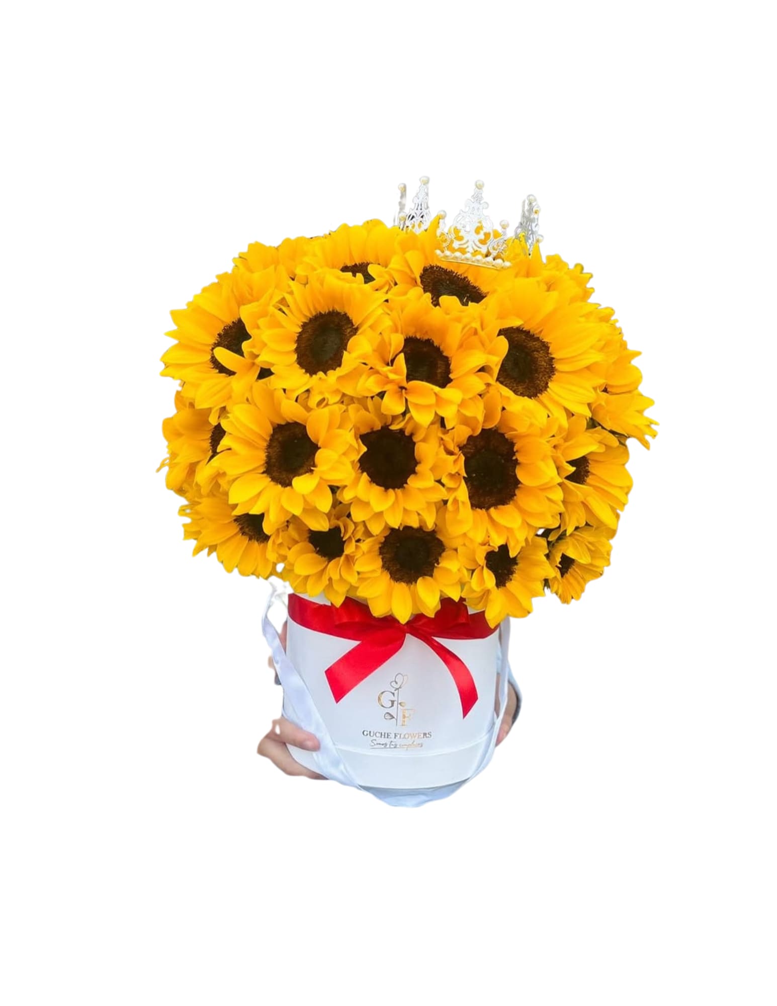 Bouquet of yellow sunflowers in a white hatbox with a red ribbon