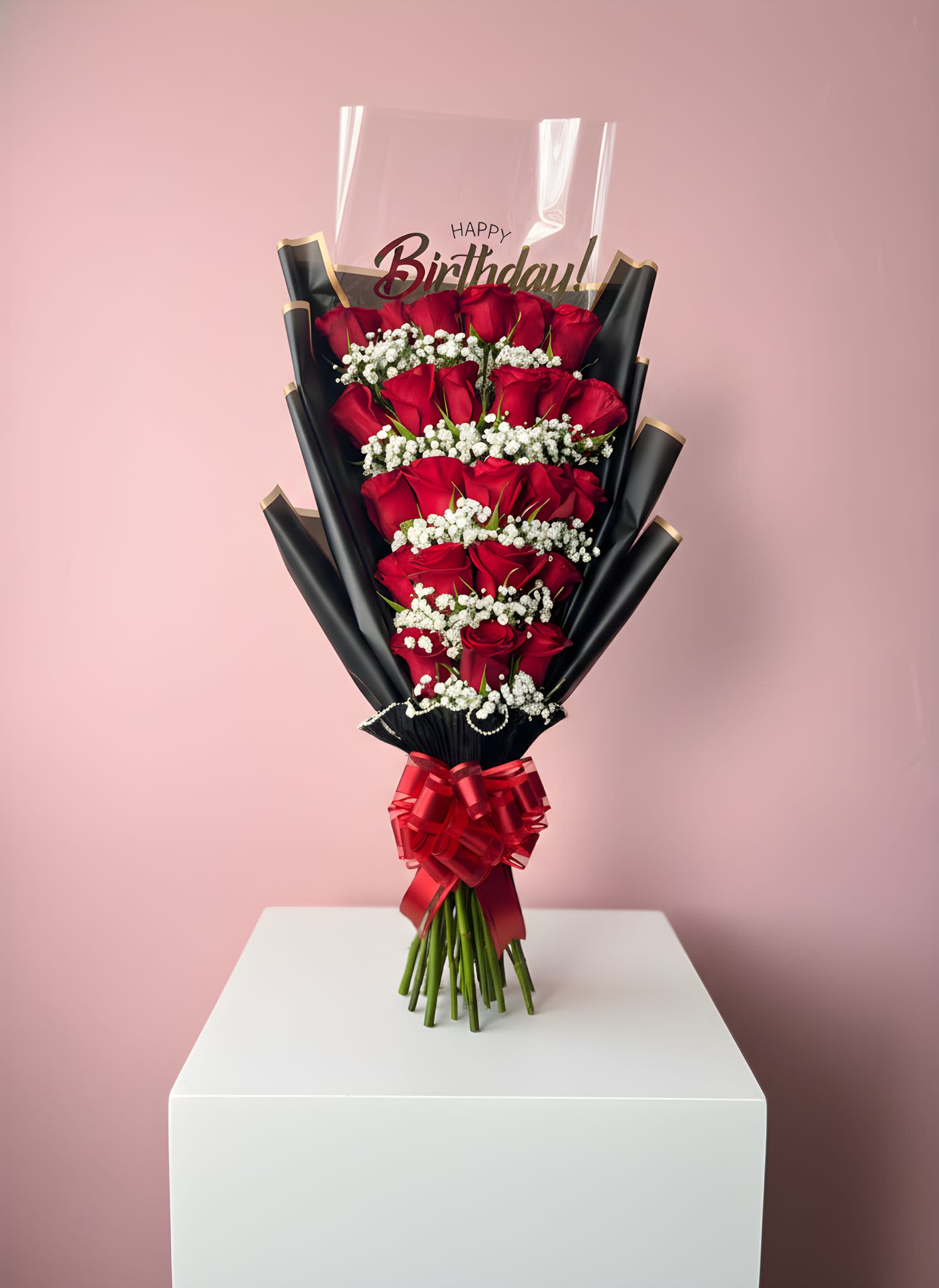 Bouquet of red roses with white baby's breath and a birthday topper