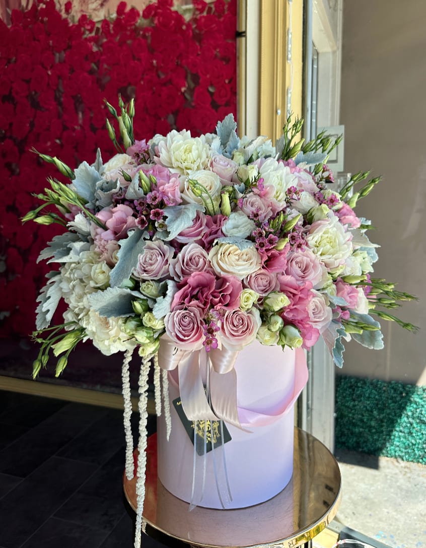 Passionate  - Brighten any space with our Elegant Flower Box Arrangement! Bursting with vibrant blooms, this stunning display combines seasonal favorites with lush fillers.   Housed in a chic, reusable container, it makes a perfect centerpiece for any occasion be it a gift or a treat for yourself. Elevate your decor with this captivating arrangement that brings joy and sophistication to your home or office. Order yours today and let the beauty of flowers inspire you!