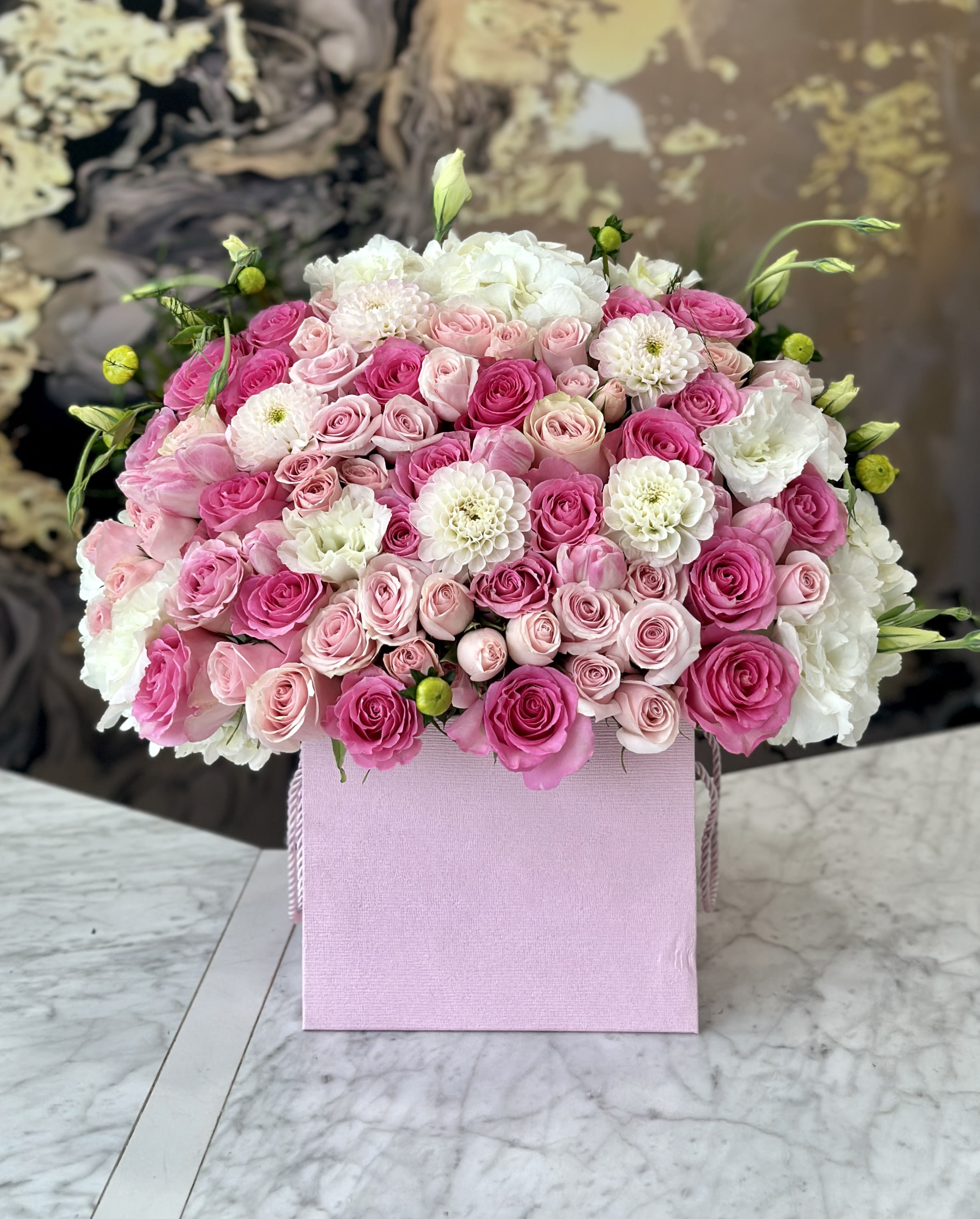 Pink and white rose bouquet in a pink gift box