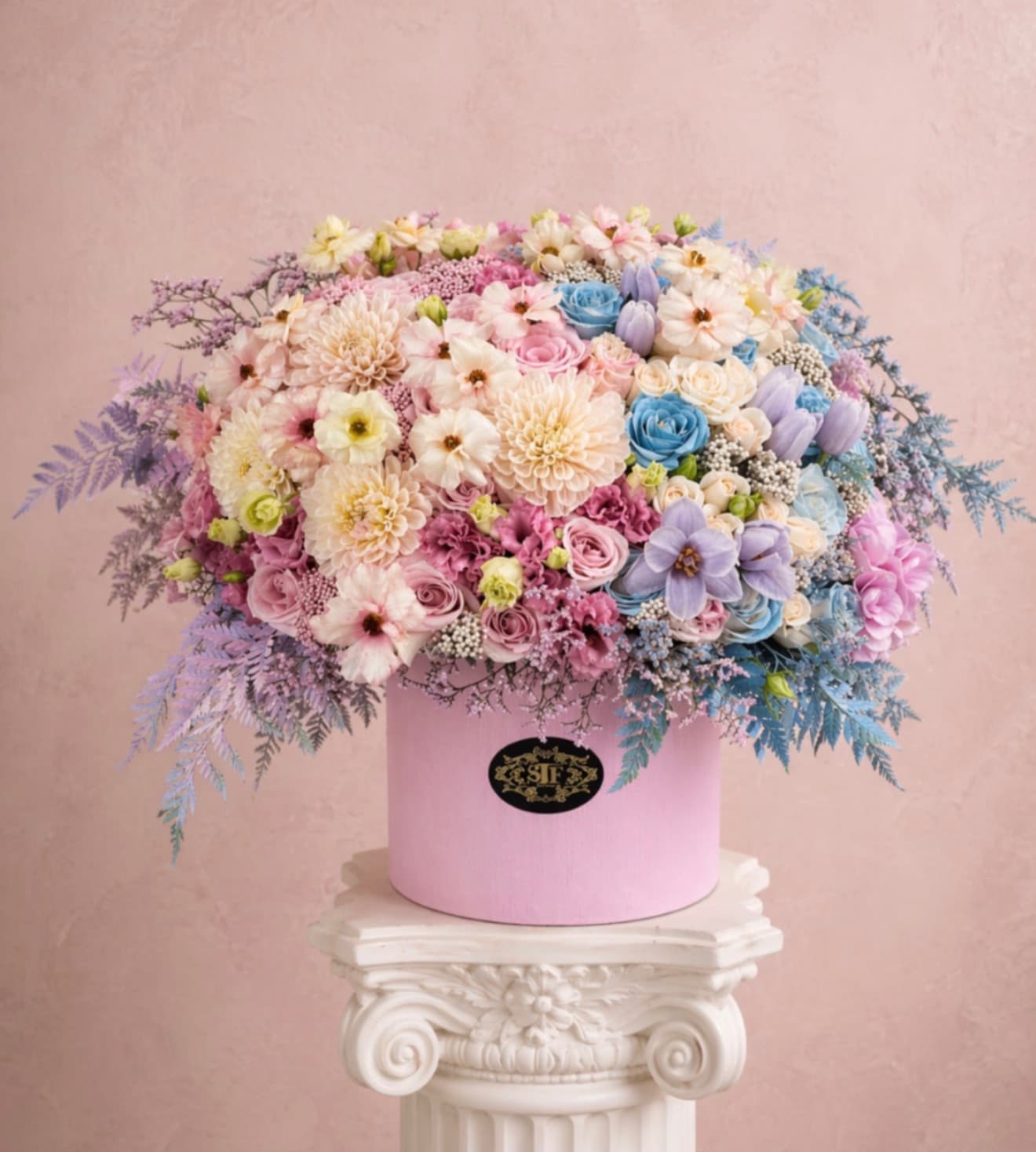 Boy or Girl? - Celebrate the exciting news with our Gender Reveal Flower Box! This playful arrangement features a stunning mix of blooms in either pink or blue, nestled among lush greenery.   Perfect for sharing the big reveal, this delightful box adds a pop of color and joy to your celebration. Each arrangement comes in a charming, reusable container that makes for a lovely keepsake.  Whether you’re throwing a party or surprising loved ones, our Gender Reveal Flower Box is a beautiful way to unveil your bundle of joy. Order yours today and let the celebration begin!