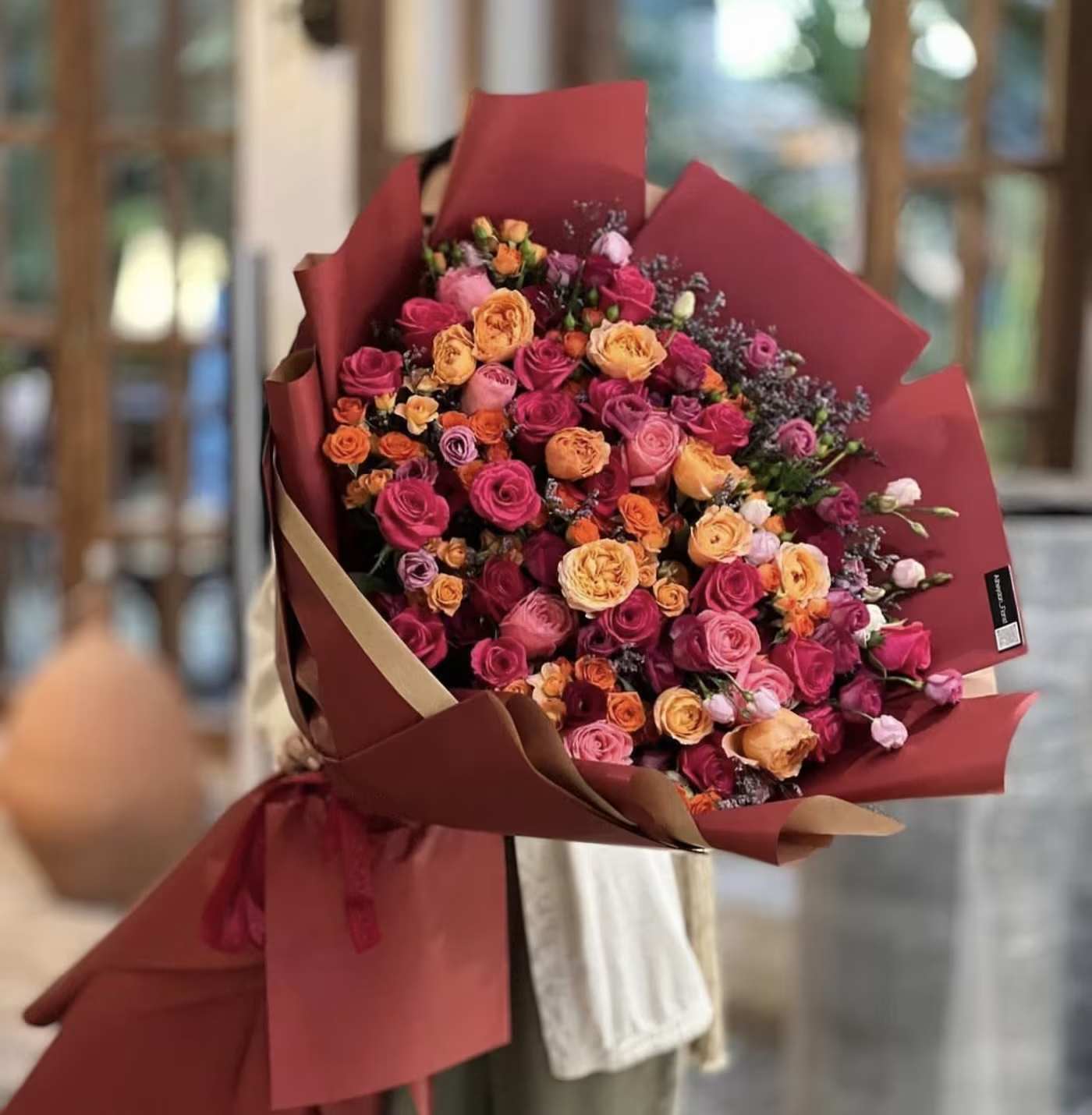 Elegance - SCV Florist - The "Elegance" bouquet is a graceful arrangement of vibrant orange and soft pink roses, paired beautifully with delicate spray roses for a touch of charm. The warm orange roses infuse energy and brightness, while the blush pink roses offer a sweet, romantic contrast. Spray roses in complementary shades add layers of texture and elegance, creating a lush, full display. This bouquet is perfect for expressing admiration, joy, or love, making it a versatile choice for any special occasion where you want to impress with refined beauty.  