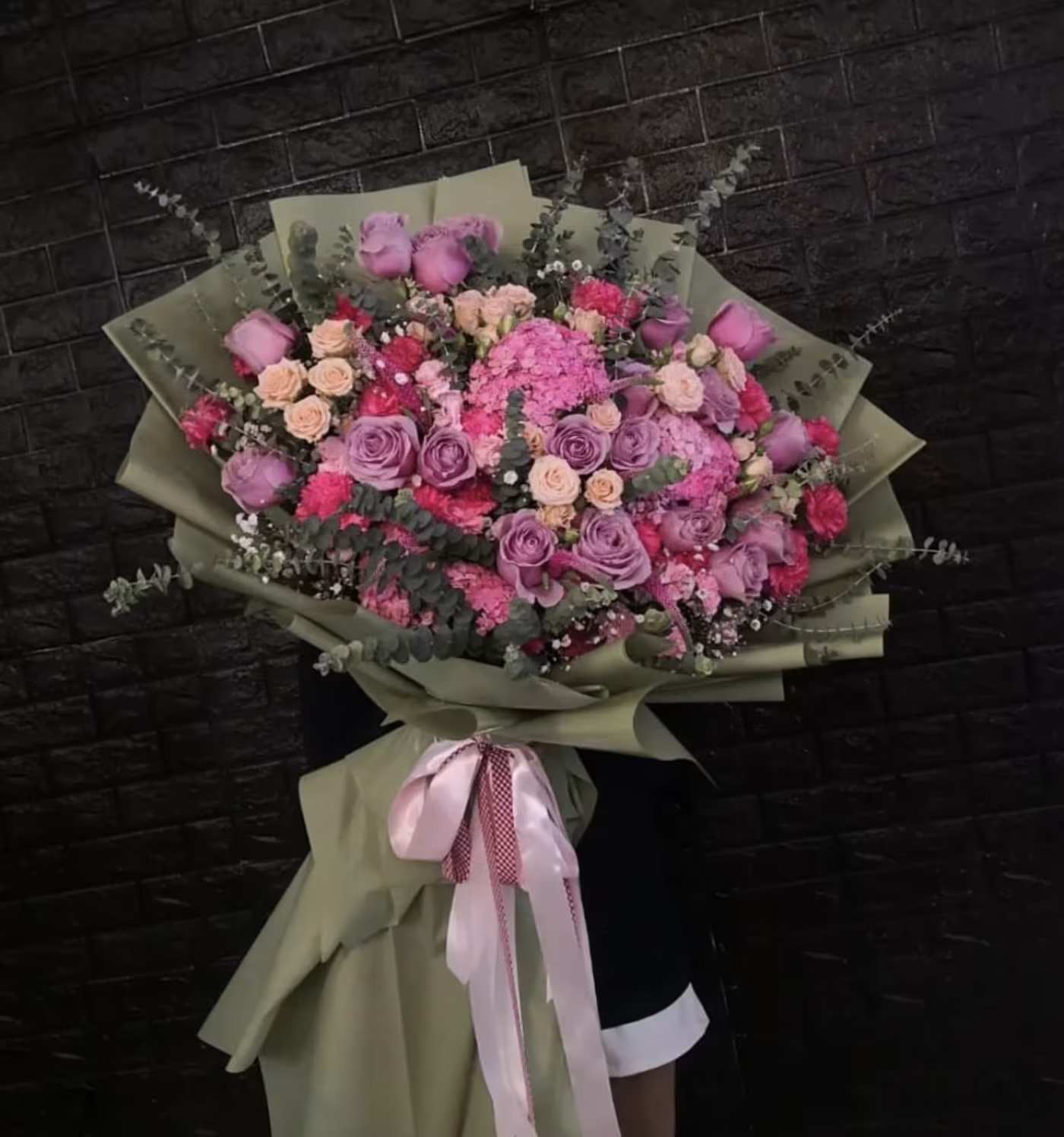Sandout - SCV Florist  - The "Standout" bouquet is a showstopping arrangement that combines the delicate beauty of pink roses, pink spray roses, and lavender roses with the lush fullness of pink hydrangeas. The soft pink roses and spray roses bring a romantic and charming touch, while the lavender roses add a unique, sophisticated hue that enhances the bouquet's allure. The voluminous pink hydrangeas provide depth and a luxurious texture, creating a bold and eye-catching composition. Perfect for making a lasting impression, the "Standout" bouquet is a radiant expression of elegance and grace, ideal for any special occasion. 