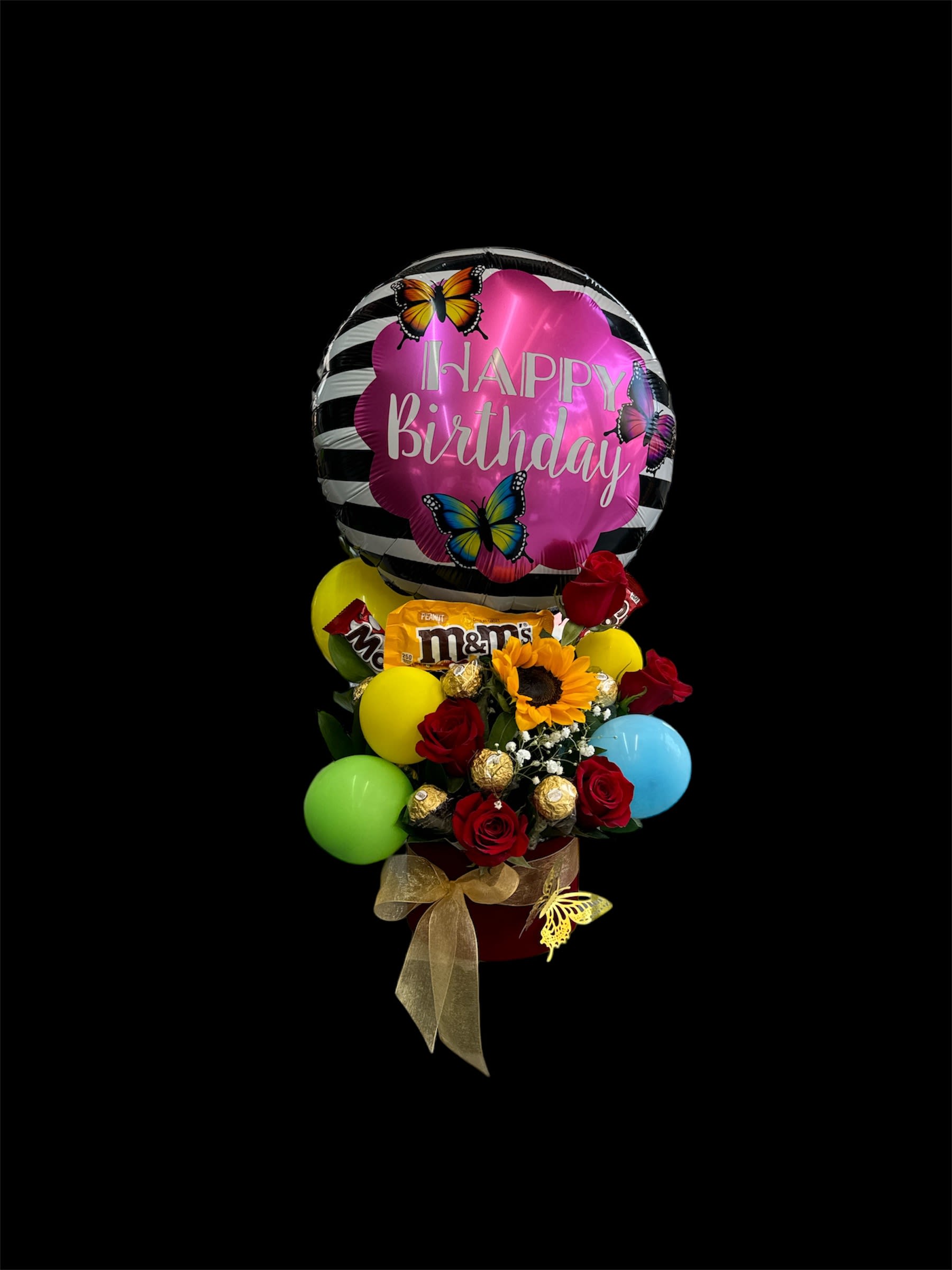 Birthday balloon arrangement with roses, sunflower, and candy
