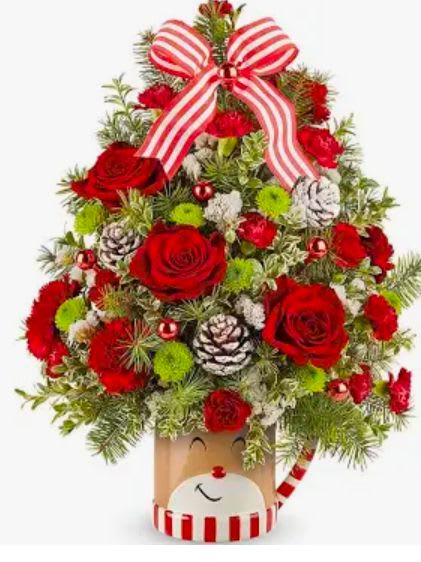 Christmas tree-shaped floral arrangement with red roses and striped ribbon