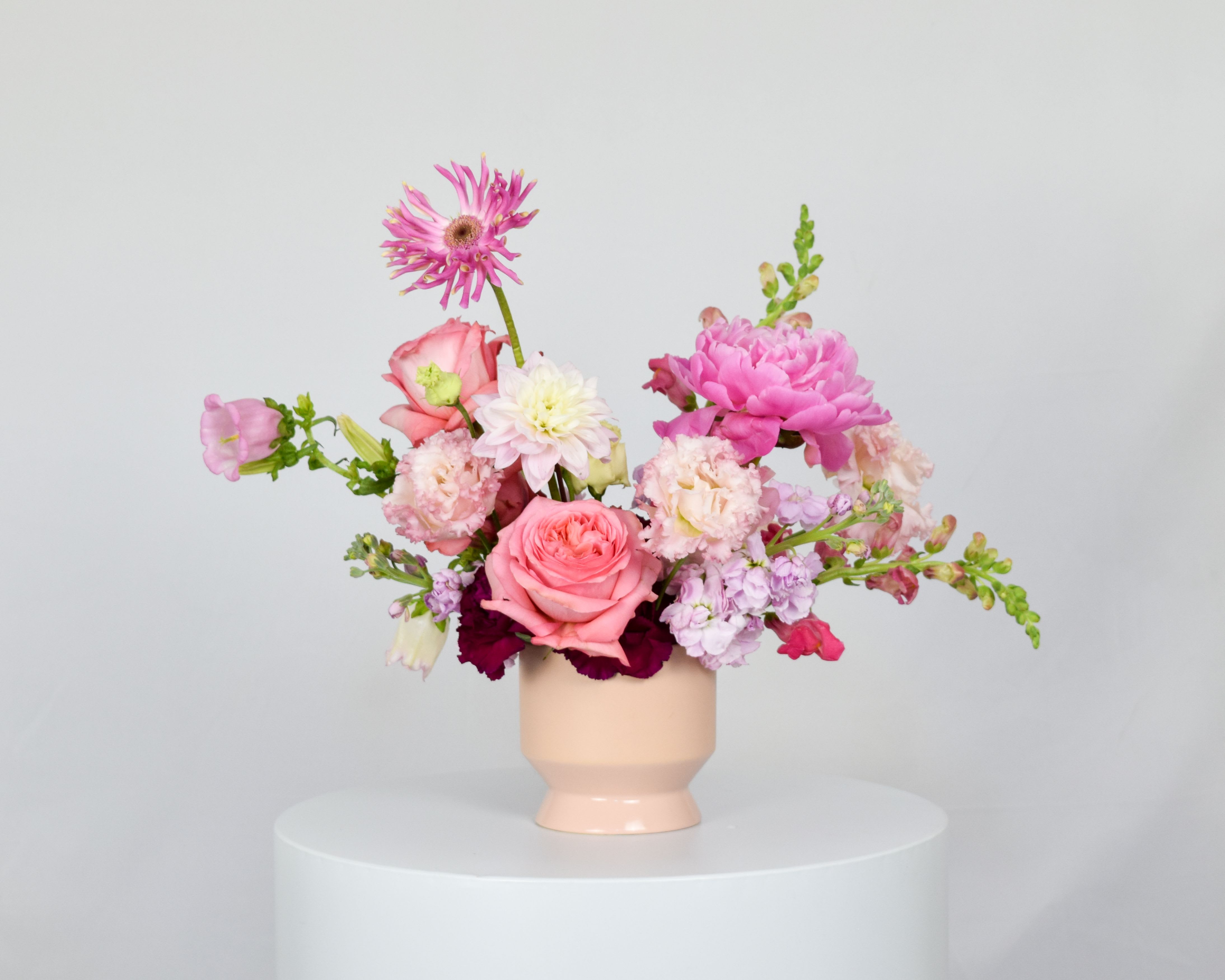 Pink and white mixed bouquet in a blush vase