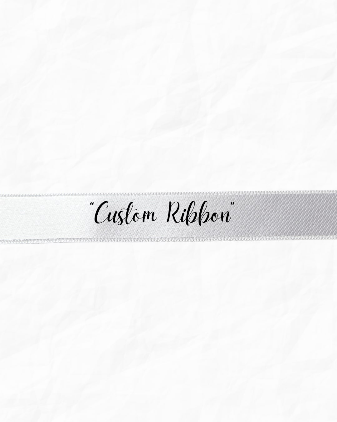White ribbon with the words "Custom Ribbon" printed in black script