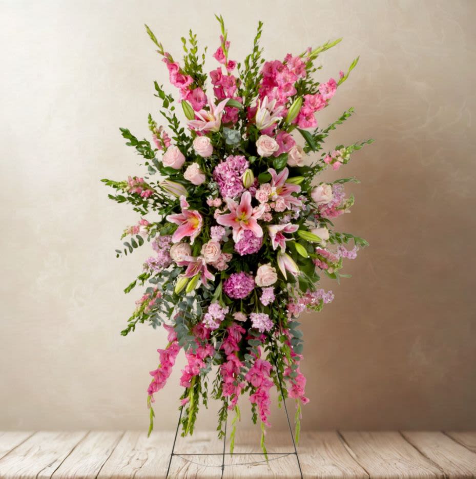Tall pink floral standing spray with lilies and roses