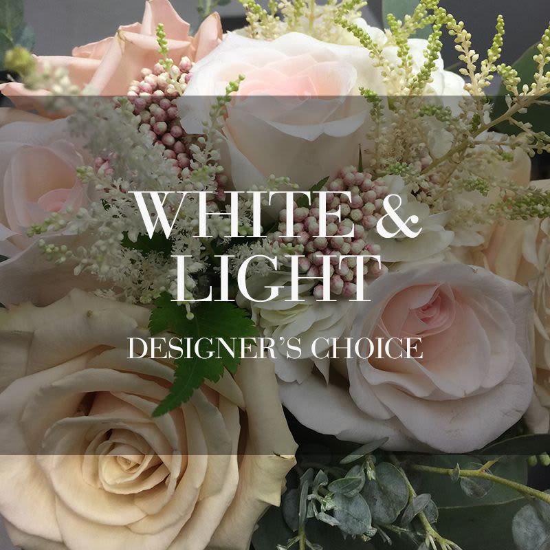 Soft pink and white roses with delicate filler flowers