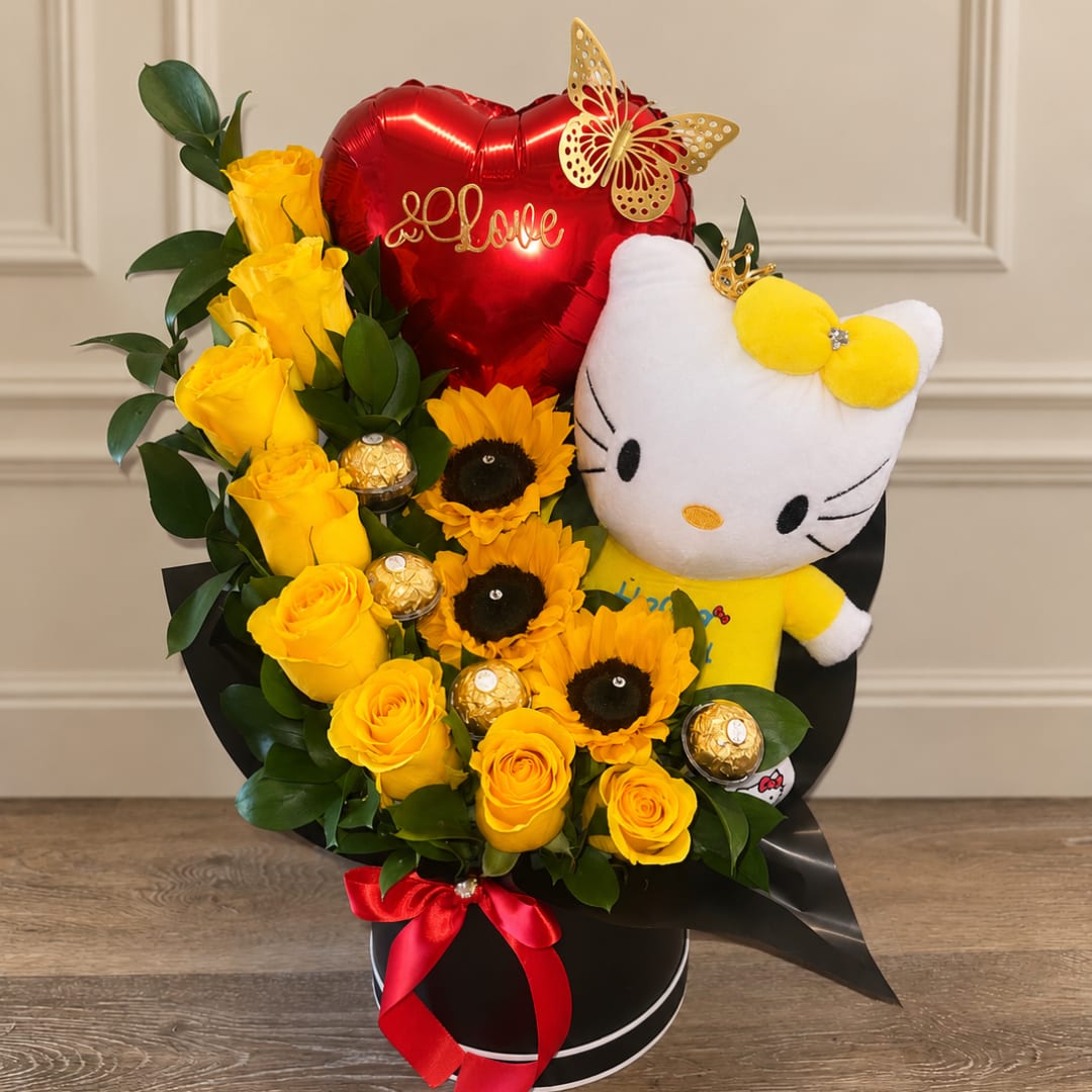 Yellow roses and sunflowers with a Hello Kitty plush, heart balloon, and chocolates in a black box